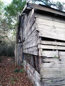 A photograph of an old wooden barn